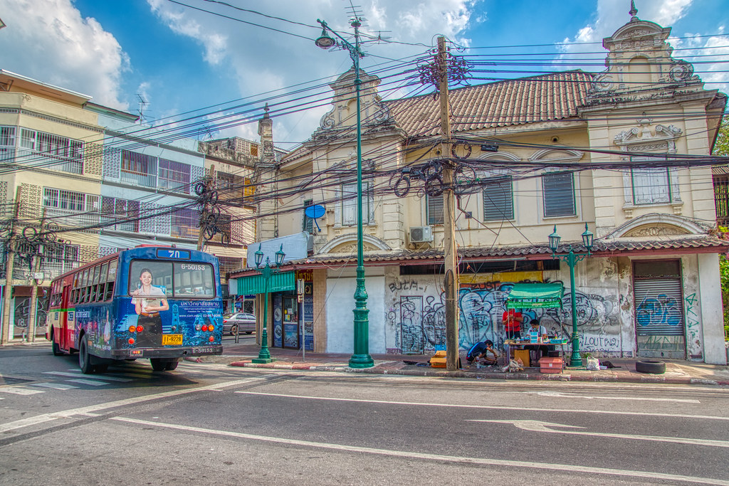 Bus turning a street corner on Rattanakosin island in Bangkok, Thailand