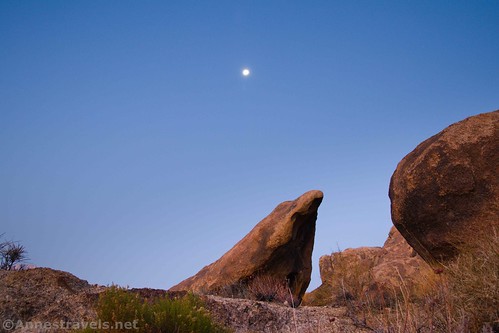 The moon over rock formations in the Alabama Hills National Scenic Area, California