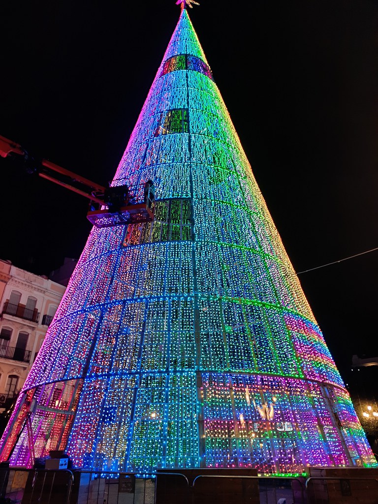 The giant Christmas tree in Seville. It is not a real tree but a structure that is lit with thousands of lights which change colour. It has a star on top, made from lights as well