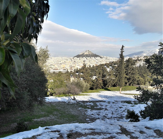 Athens view in snow, from Pnika hill, towards Lycabettus hill