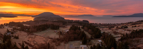 Dramatic Lummi Island Sunrise by EdBob, Panoramic aerial drone view of a winter sunrise in the Salish Sea area of the Pacific Northwest.

Al