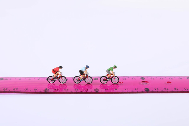 Cyclists on a measure tape