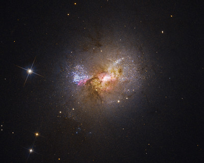 Hubble Finds a Black Hole Igniting Star Formation in a Dwarf Galaxy