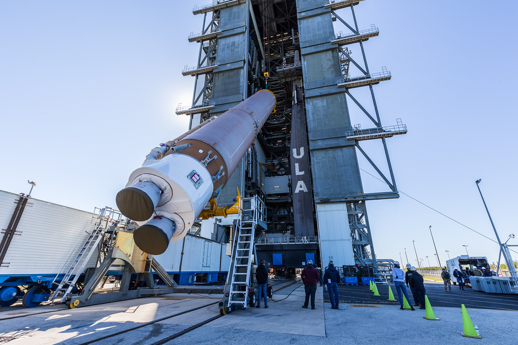 The Atlas V booster is hoisted into the Vertical Integration Facility
