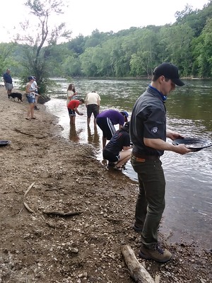 photo of people search for gold along the James River