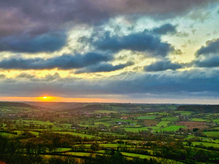 Sun rising over Devon fields
