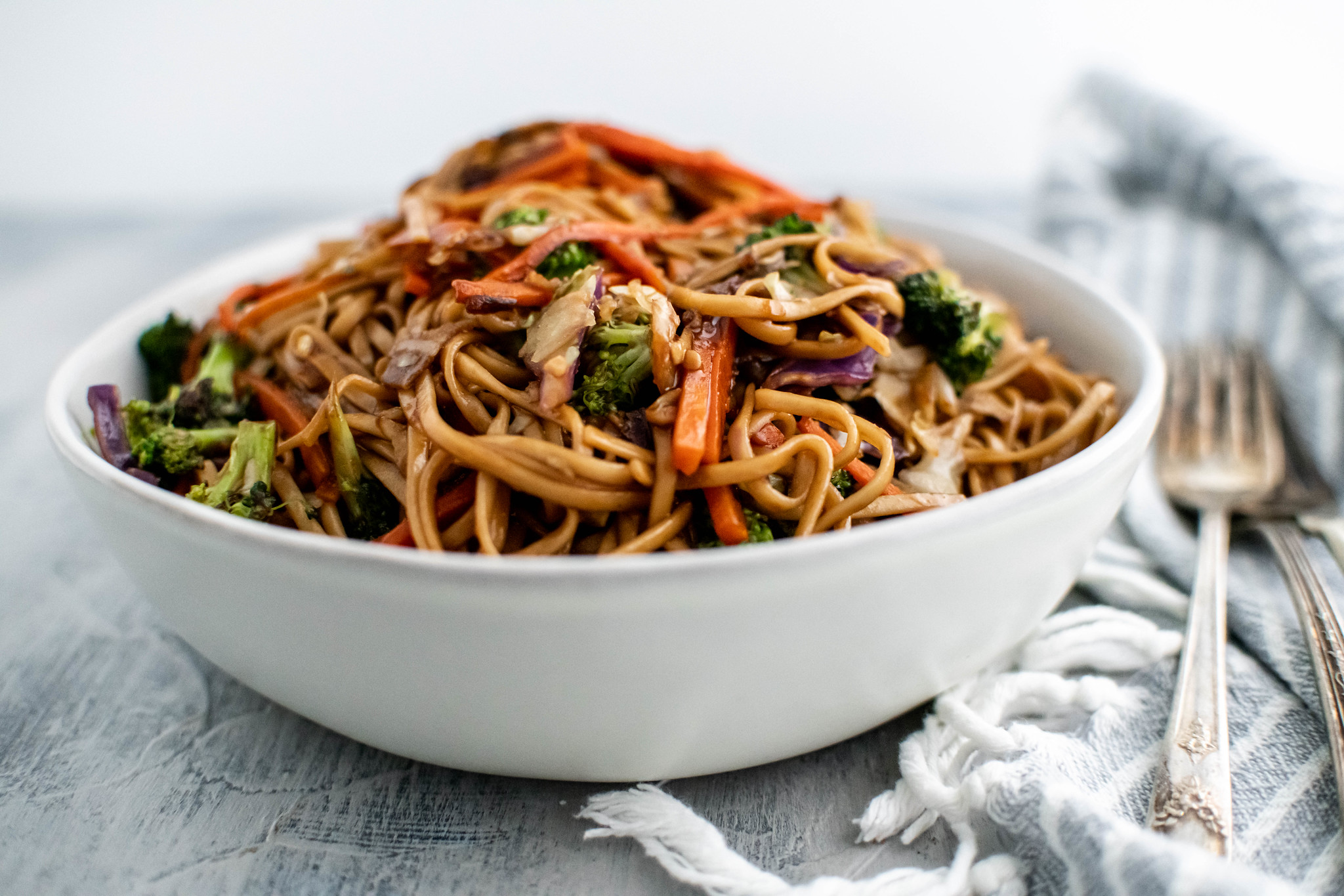 White bowl filled with veggie lo mein.