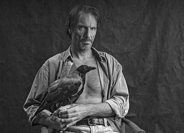 a man with his crow