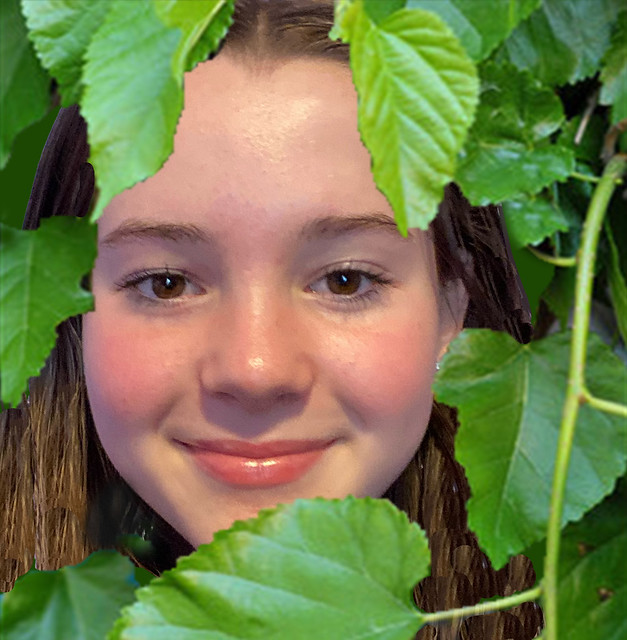 Alyssa behind the Leaves