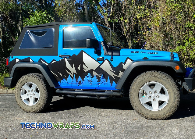 Jeep vinyl wrap with mountains and Bigfoot