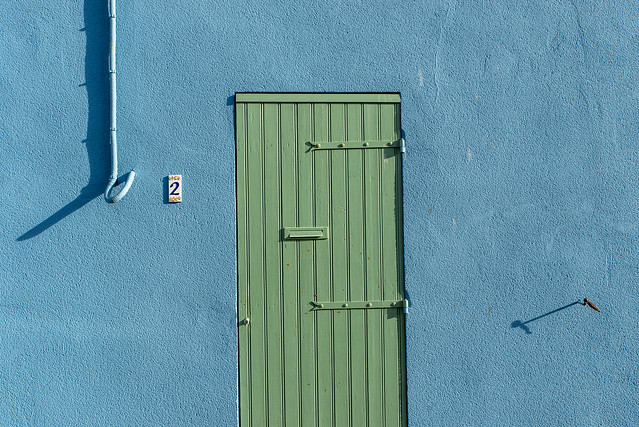 Green door, blue wall