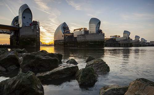 river thames london england uk reflection ray wise gatty images construction architecture sunset water rocks dangerous location tidal barrier still calm tranquill o2 arena mellennium dome 02