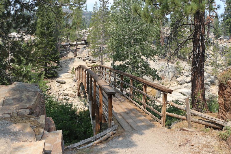 Crossing the arched wooden bridge over the Middle Fork San Joaquin River in Devils Postpile NM