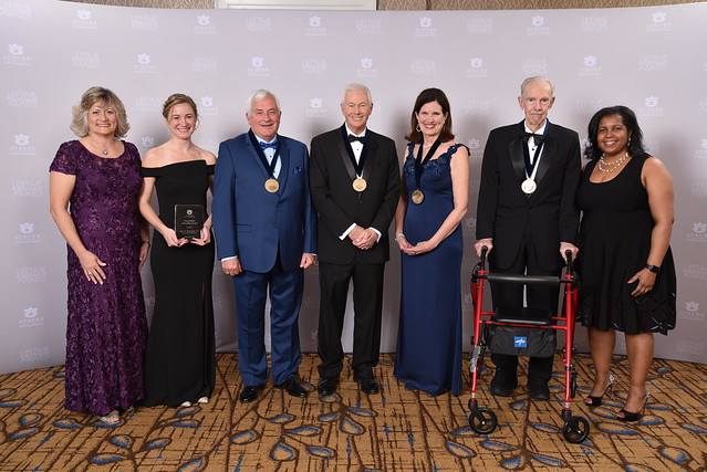 Several people pose for the Lifetime Achievement Awards