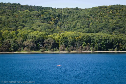 A lone canoeist out on Hemlock Lake, New York