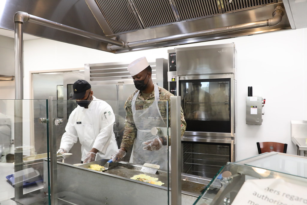 Patriot CDR and Staff Majors prep and serve breakfast
