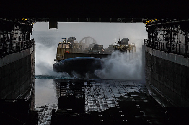 A landing craft, air cushion (LCAC) enters the well deck of the amphibious transport dock ship USS Green Bay (LPD 20) during Cobra Gold 22.