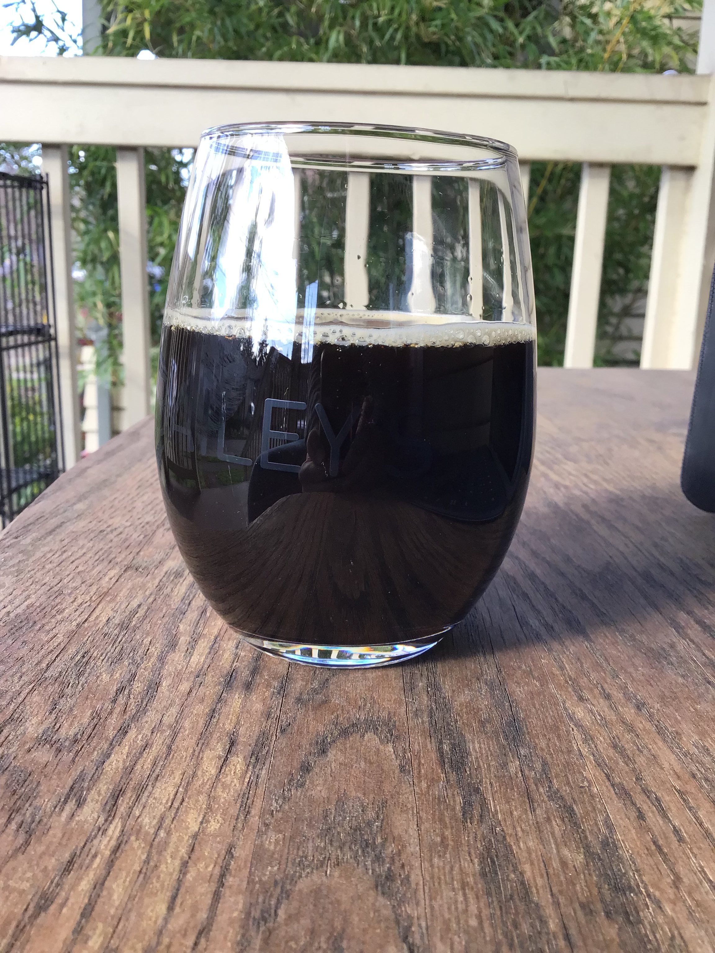 Kobold's Lawful Evil imperial stout in glass outside