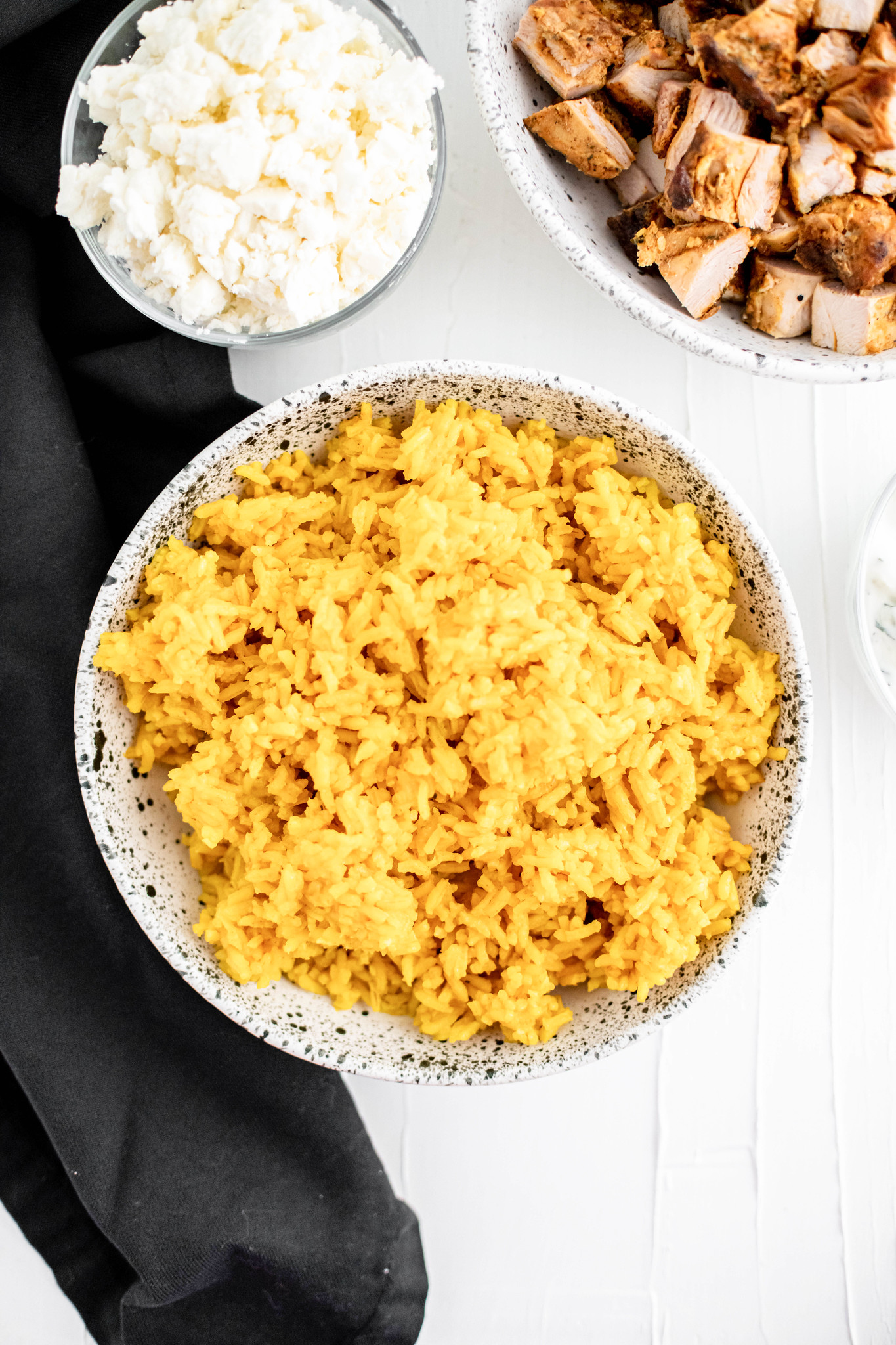 Close up of bowl of golden tumeric rice.