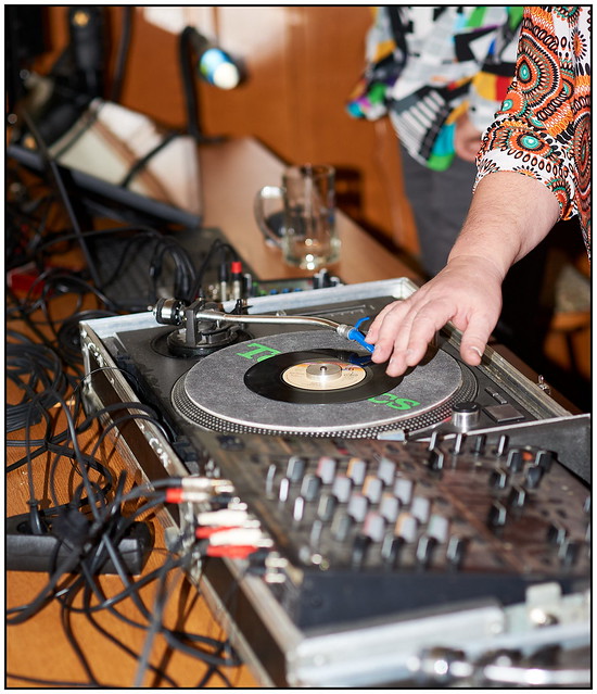 DJ in action on classic turntable