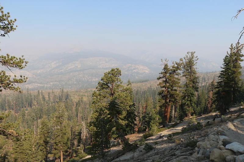 View north toward the Devils Postpile (down below in the smoky haze) from the PCT south of Reds Meadow