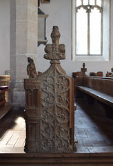 floral bench end with St Roch and his dog
