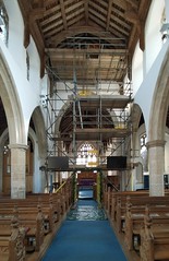 scaffolding for installing new glass in the window above the chancel arch