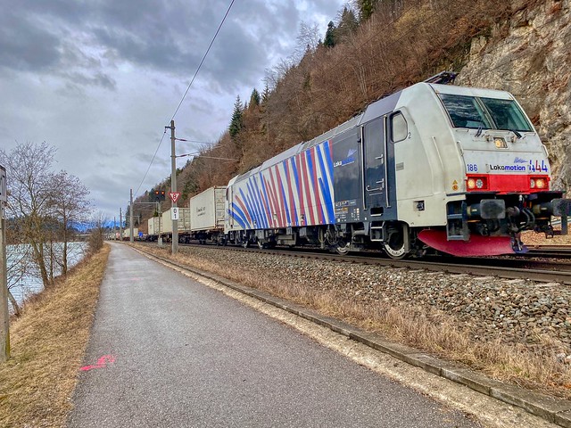 TRAXX electric locomotive for Lokomotion hauling cargo through the river Inn valley near Kufstein in Tyrol, Austria