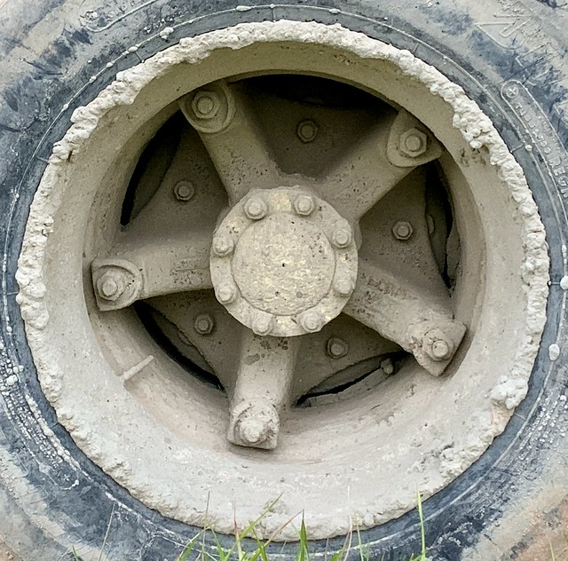 Muddy truck wheel with five spokes