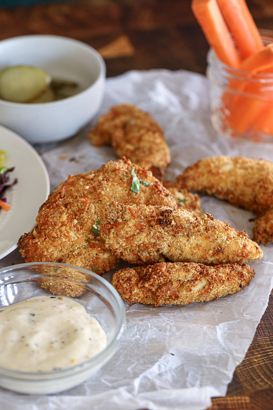 Crispy air fried chicken tenders on parchment paper