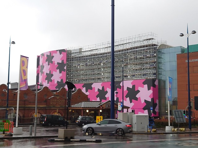 Part of the pink artwork at Selfridges coming down on Moor Street