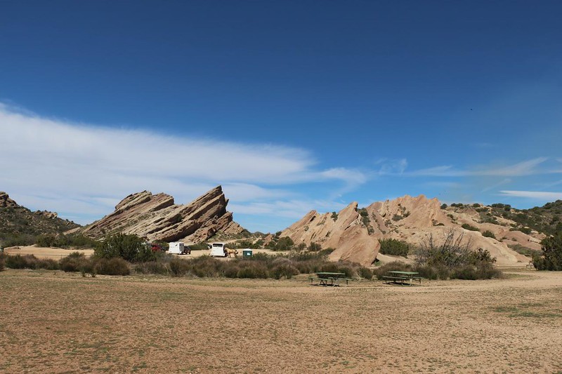 Picnic area and horse trailers in the parking lot near the sandstone peaks within Vasquez Rocks County Park