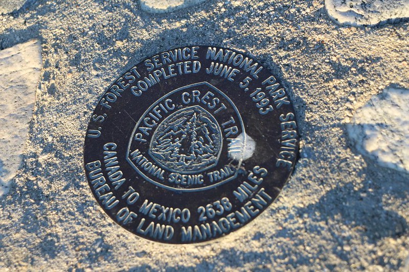 Brass marker on top of the Golden Spike Pacific Crest Trail Completion Monument in Soledad Canyon