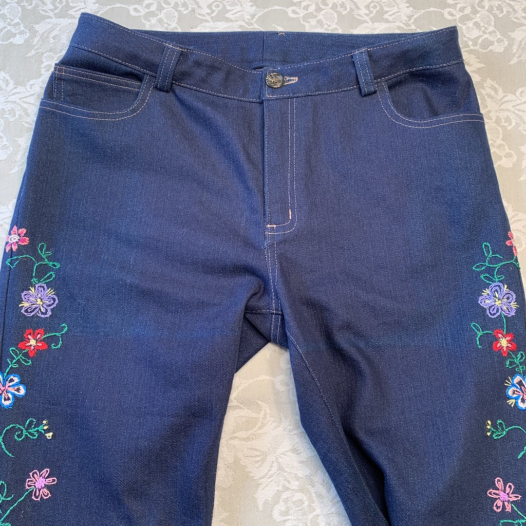 embroidered jeans front view