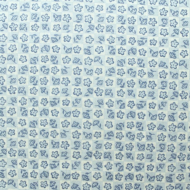 Small Blue Flowers On A Cream Background