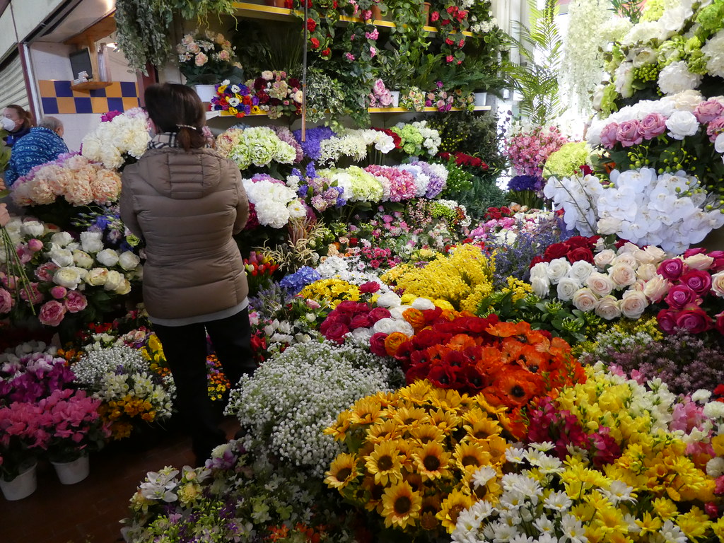 Fresh flowers in Ventimiglia covered market, Italy