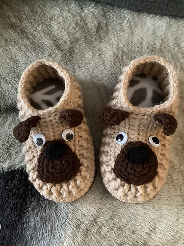 Catherine (MCatherineL) is a prolific crocheter of beautiful slippers! These are The Snuggly Pug Slippers by Ira Rott using the sole pattern from Galilee Slippers by Mamachee.