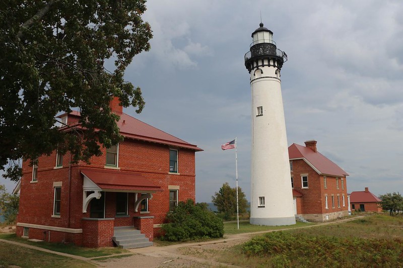 View of the Au Sable Point Lighthouse and outbuildings at Pictured Rocks National Lakeshore
