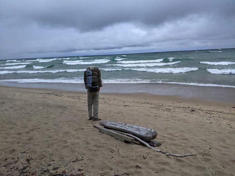 Me, standing on the shore of Lake Superior looking at the big waves, from Pictured Rocks National Lakeshore