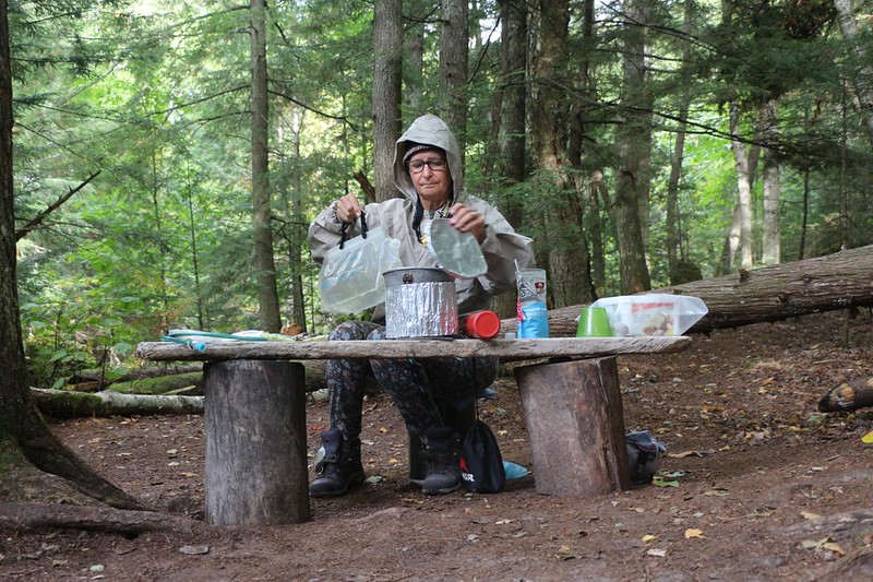 Vicki making dinner at the Sevenmile Creek backpackers campsite on the North Country Trail in Pictured Rocks NL