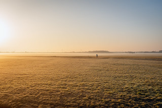 Woman running in a Dutch polder