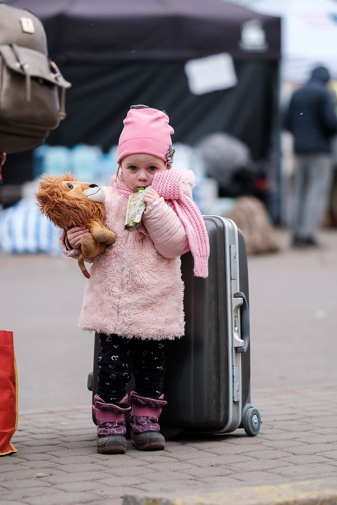 After a tiring journey, children can take food and toys that volunteers have prepared for them. War in Ukraine. Polish-Ukrainian border crossings, 4-6.03.2022.