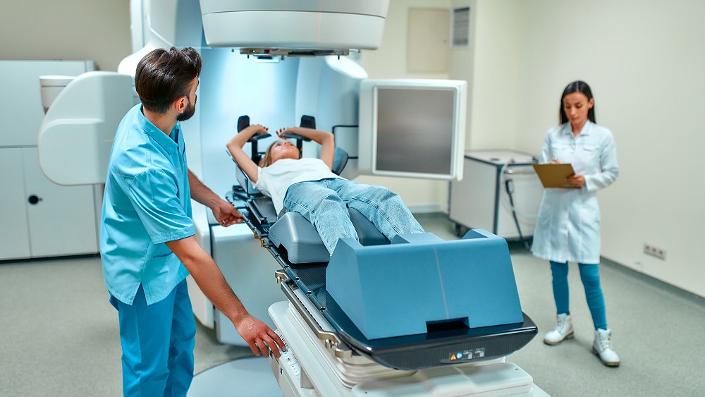 Woman undergoing radiotherapy