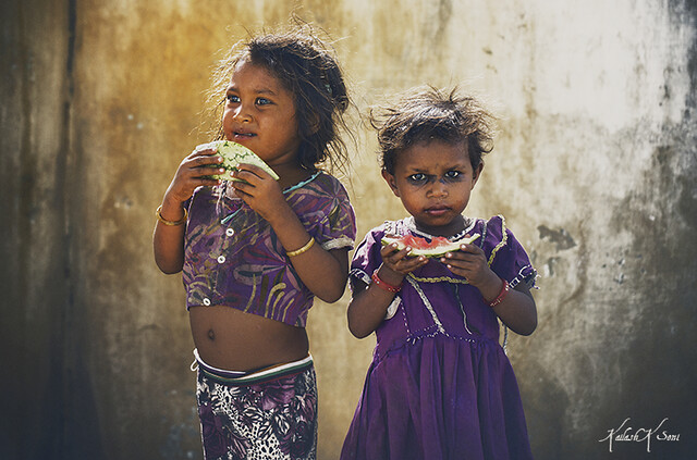 Indian rural girls eating water melon