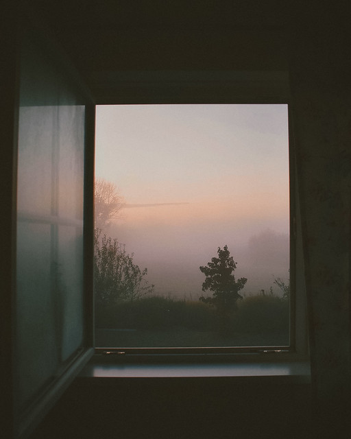 misty morning sunrise window view