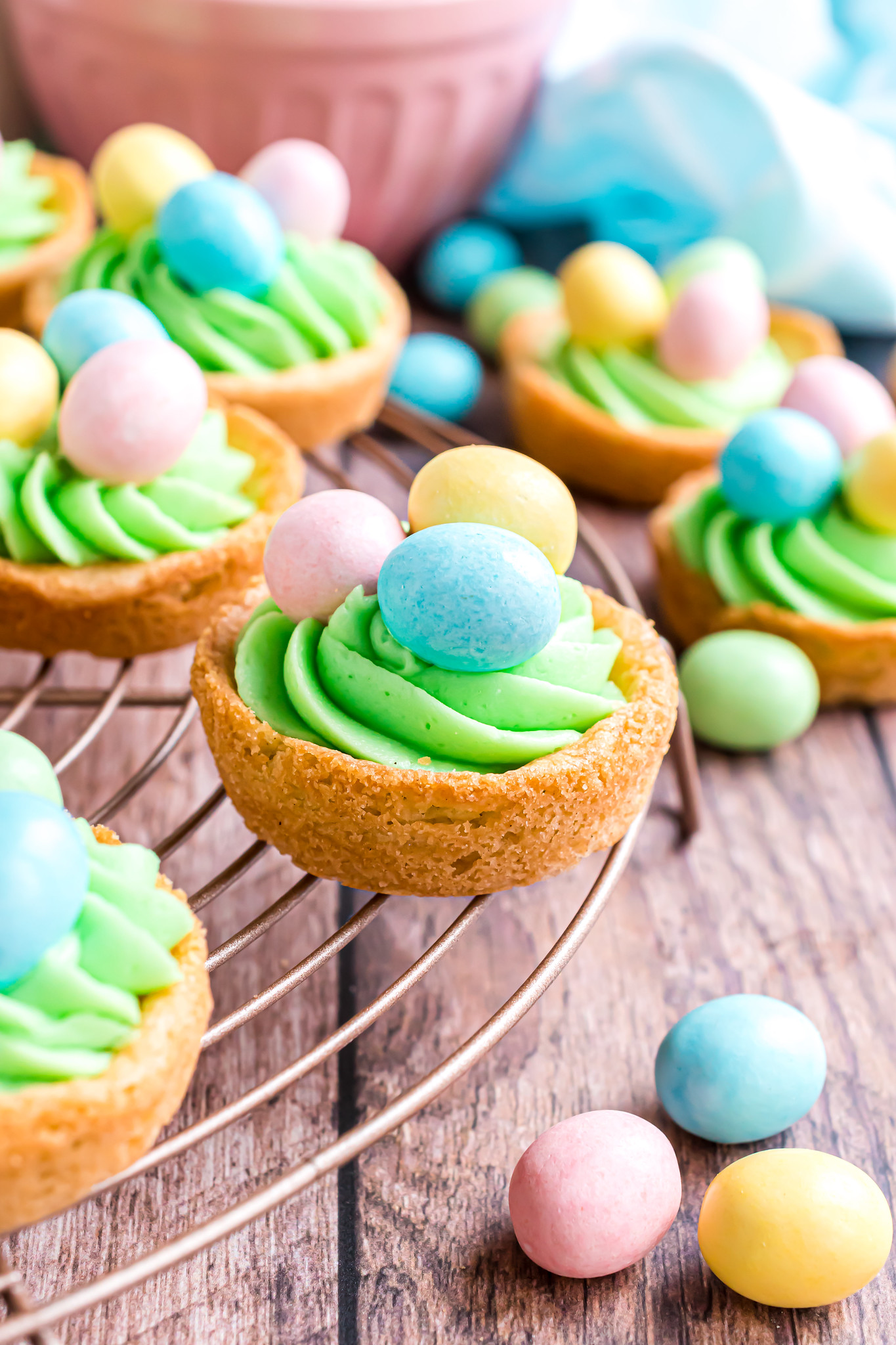 Easter sugar cookies with egg candies on a wire rack 
