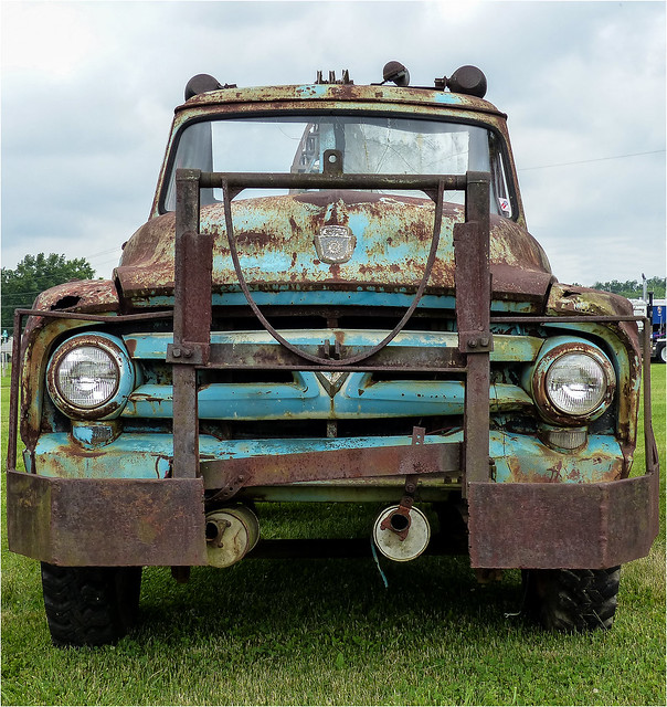 Rear View Of A Rusty Old Ford Tow Truck