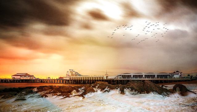 Clacton Pier in the snow at sunset