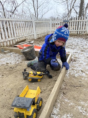 chiseling out frozen sand chunks