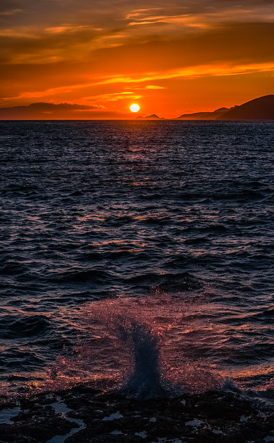 Wavy sea at sunset